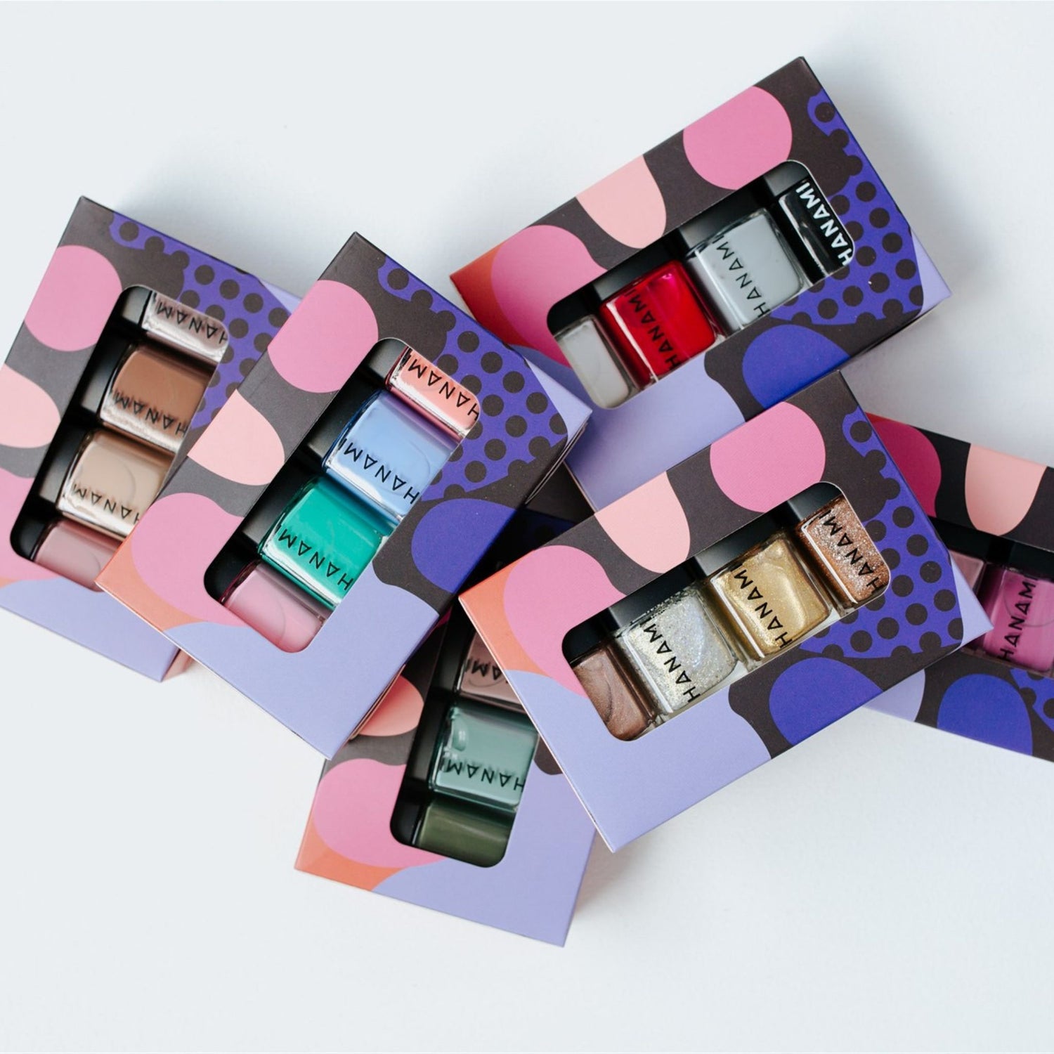 Variety of Hanami cruelty free nail polishes in gift boxes